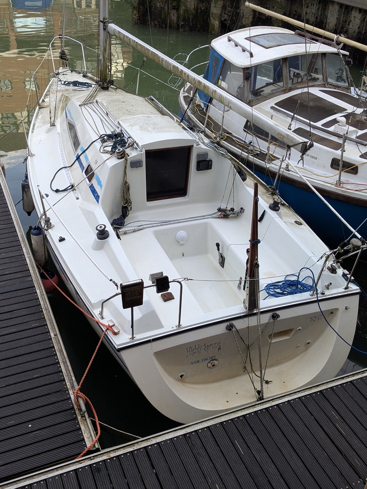 Highly Sprung moored alongside another boat