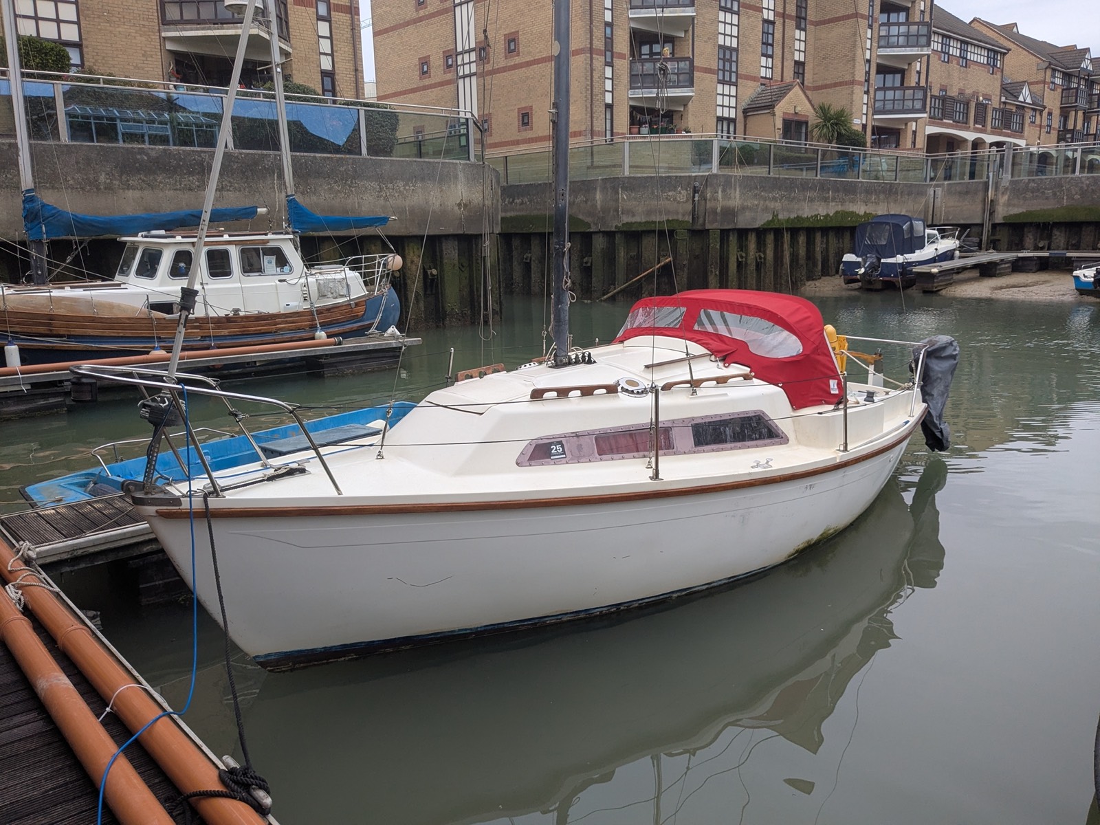 Space Invader, an Invader 22 day sailer, moored in a marina